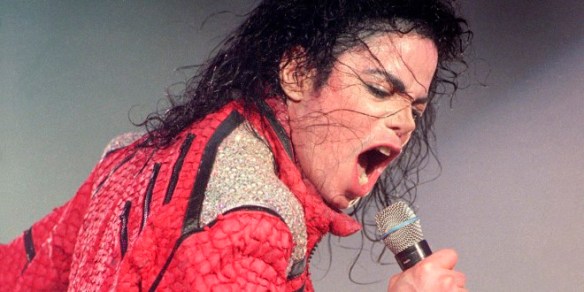 Michael Jackson performs live on stage, 1996. (Photo by Phil Dent/Redferns)